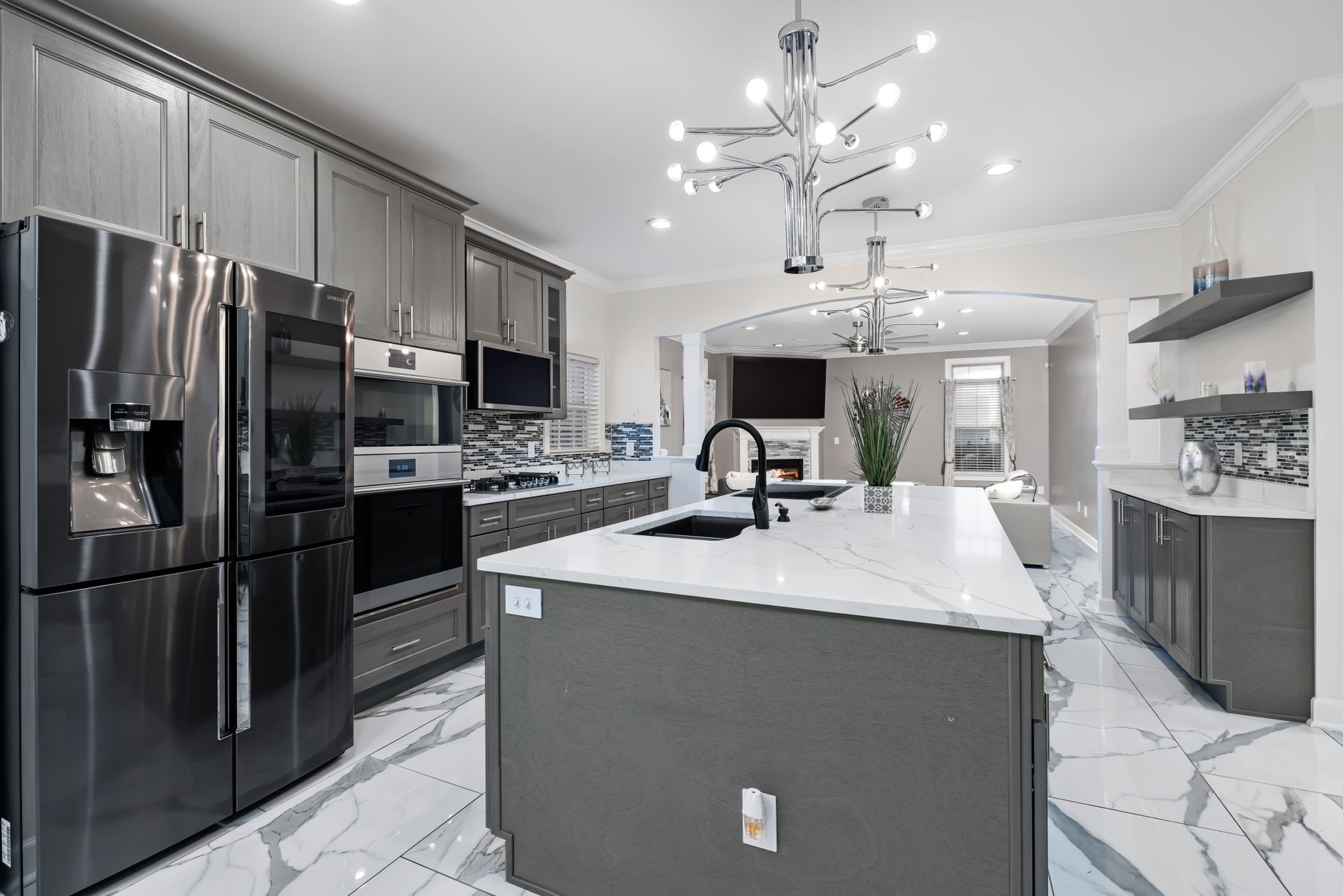 Sleek modern kitchen design featuring stainless steel appliances, marble countertops, and elegant in Rancho Cucamonga, CA